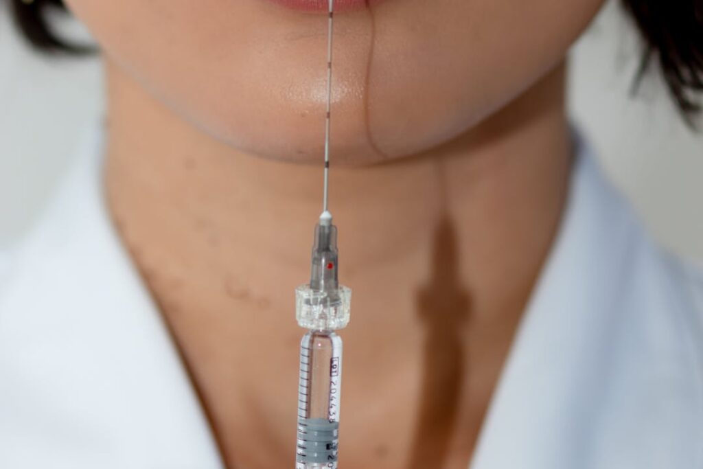 close up of esthetician and collagen stimulating injection