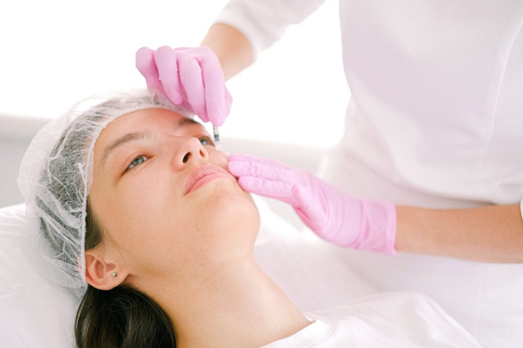 woman getting collagen stimulating injection