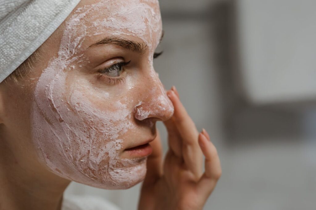 woman washing her face, is niacinamide good for acne